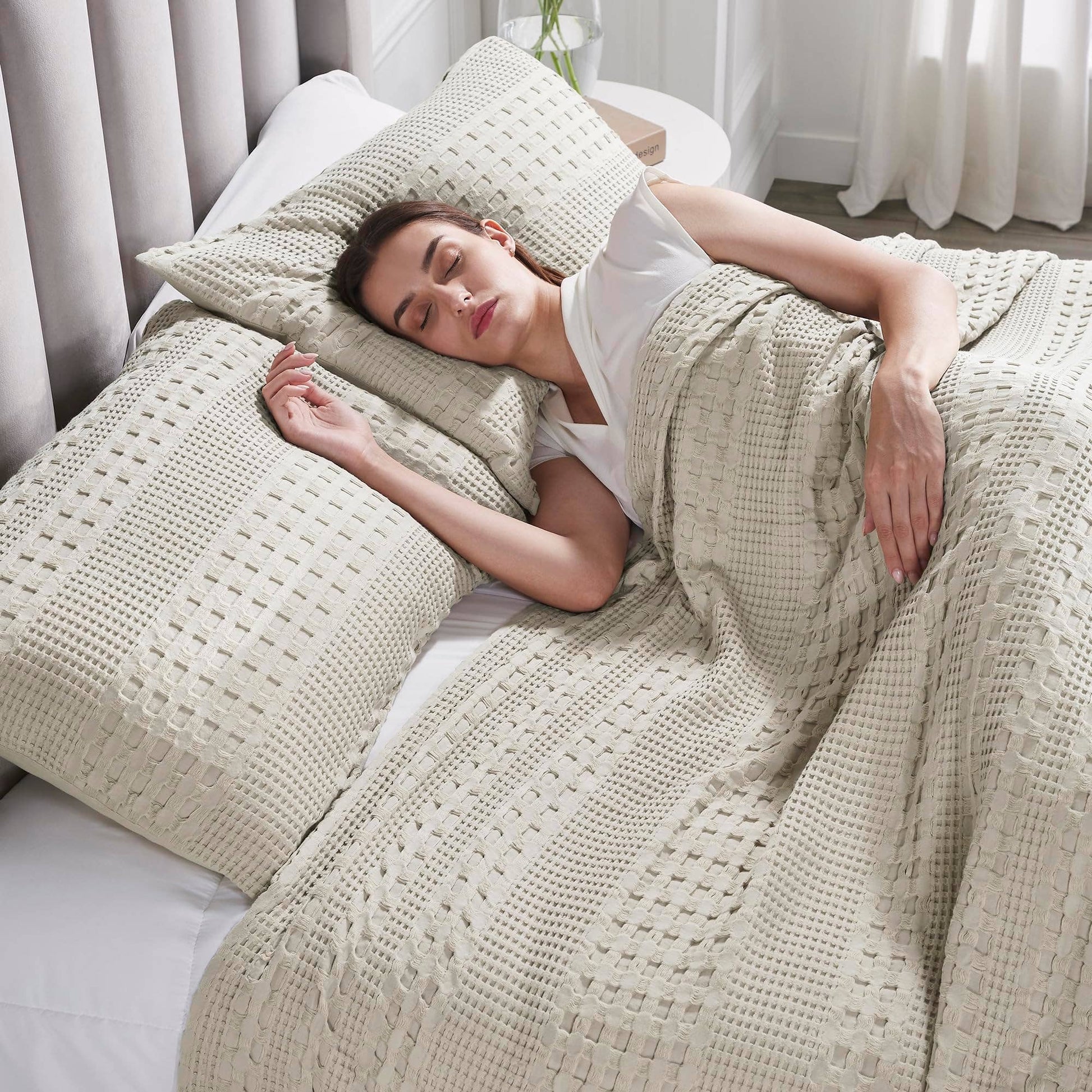 Person comfortably lying with Waffle Weave pillow by belle aura