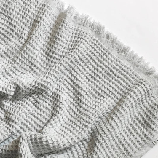 Cozy folded Waffle Turkish Cotton Blanket in Gray by Belle Aura