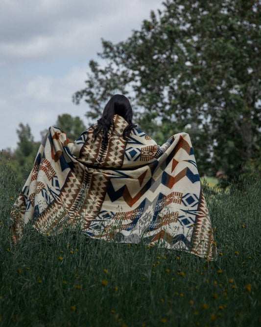 Person Holding Patterned Awa Blanket Outdoors by Belle Aura