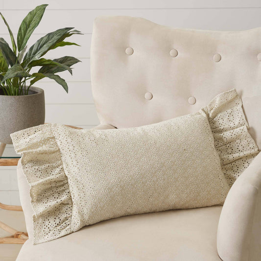 Camilia Eyelet Pillow By Belle Aura On Cozy Beige Chair With Ruffled Edges