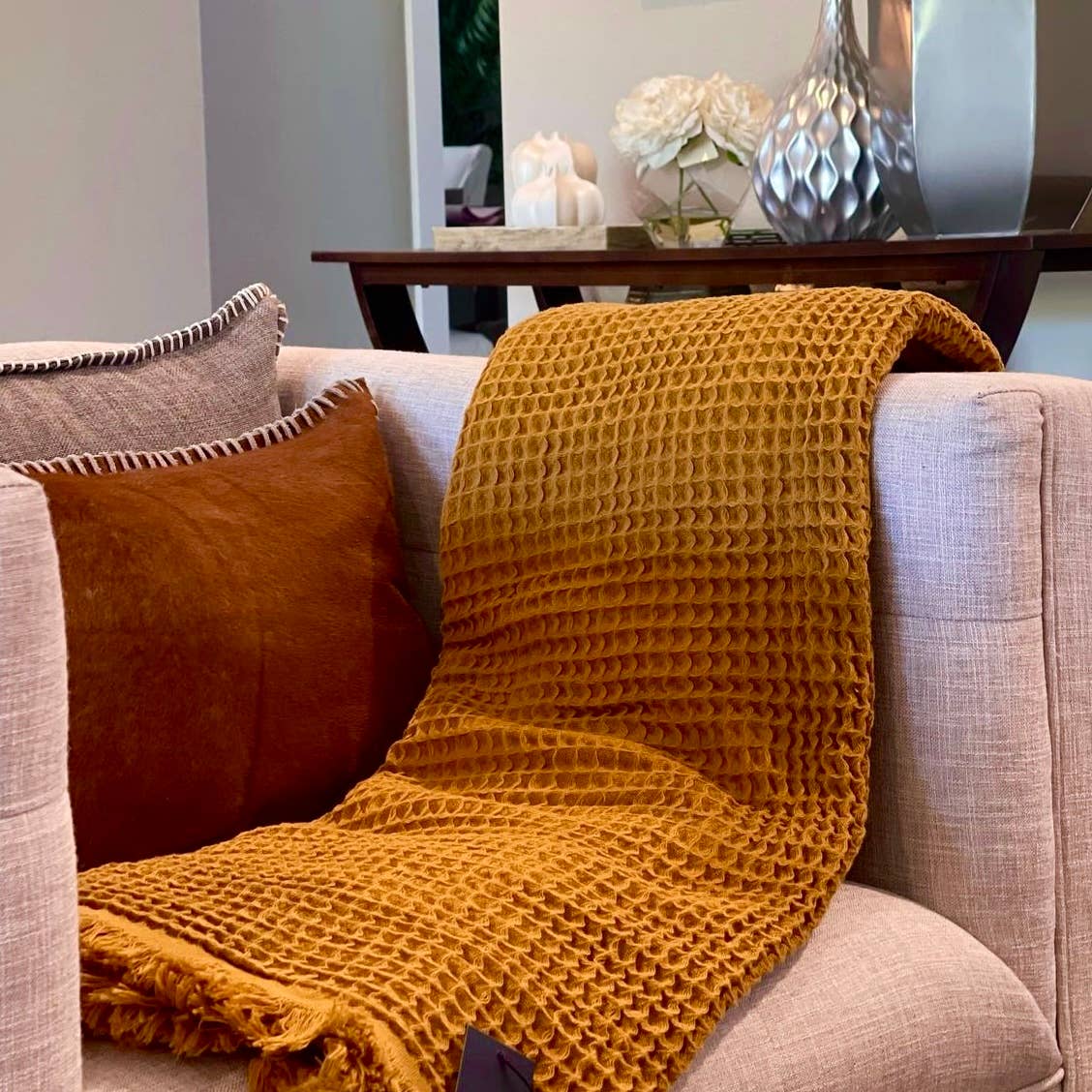 Mustard Waffle Turkish Cotton Blanket draped over cozy sofa by belle aura