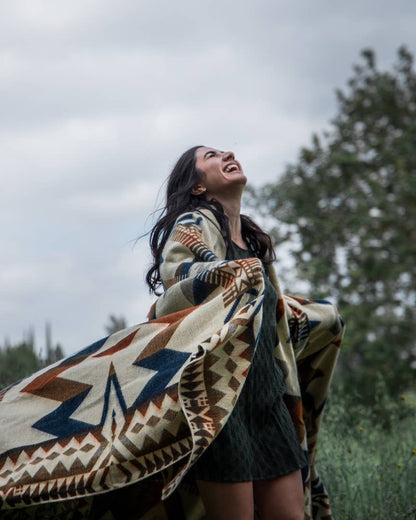 Woman Wrapped in Cozy Patterned Awa Blanket by Belle Aura