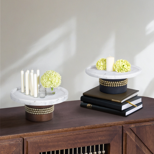 Aurelia Cake Stand in Walnut by Belle Aura, Placed On A Table With Books In A Home Setting
