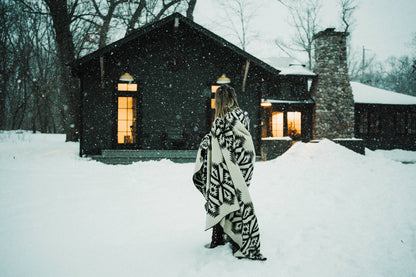 Person Standing in Snow Wearing Quichua Blanket by Belle Aura