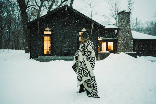 Person Standing in Snow Wearing Quichua Blanket by Belle Aura