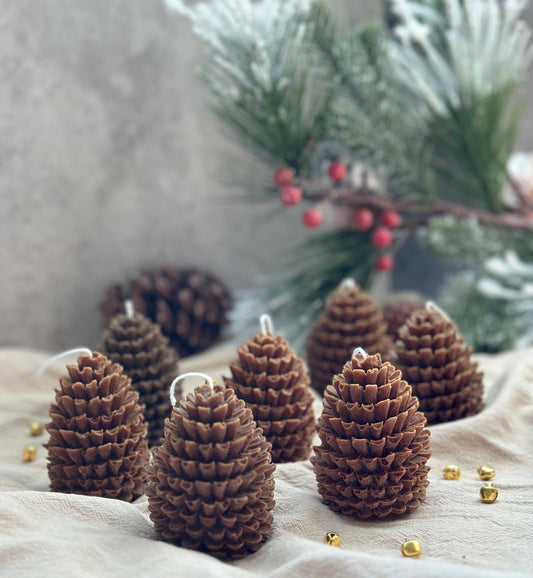 Brown Pine Cone Candles with holiday decor by belle aura