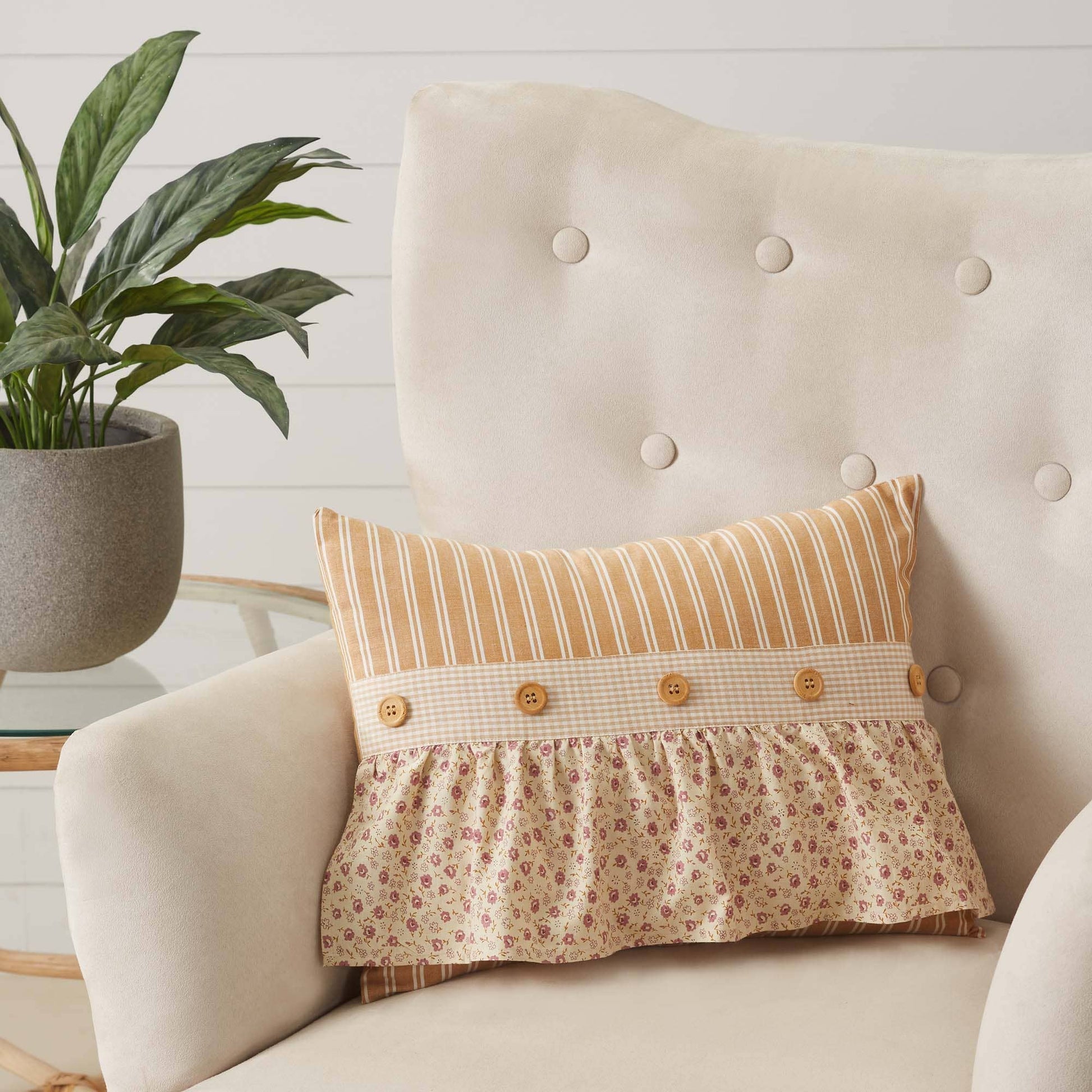 Beige armchair with Camilia Ruffled Pillow By Belle Aura