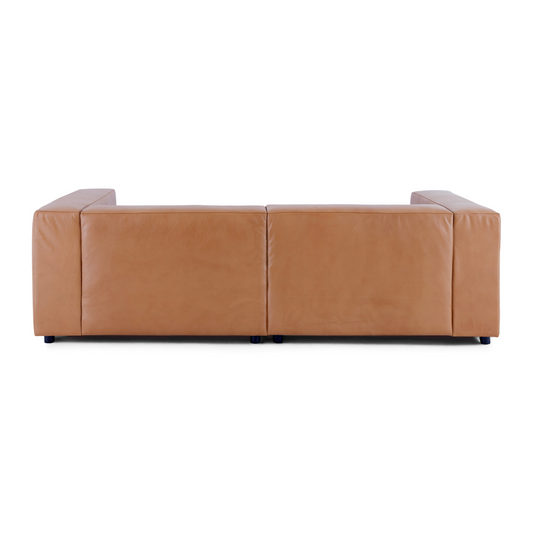 The rear view of the Aaran sofa, showcasing the continuous leather wrap and clean, finished look from every angle.
