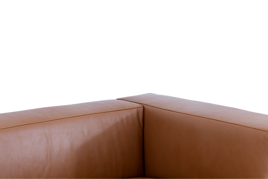 A close-up detail of the Aaran sofa’s top grain leather, showcasing the natural grain and high-quality tonal stitching.
