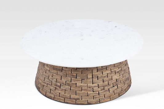 An angled front view of the Charme Coffee Table, highlighting the high-contrast design between the polished stone and woven organic base.