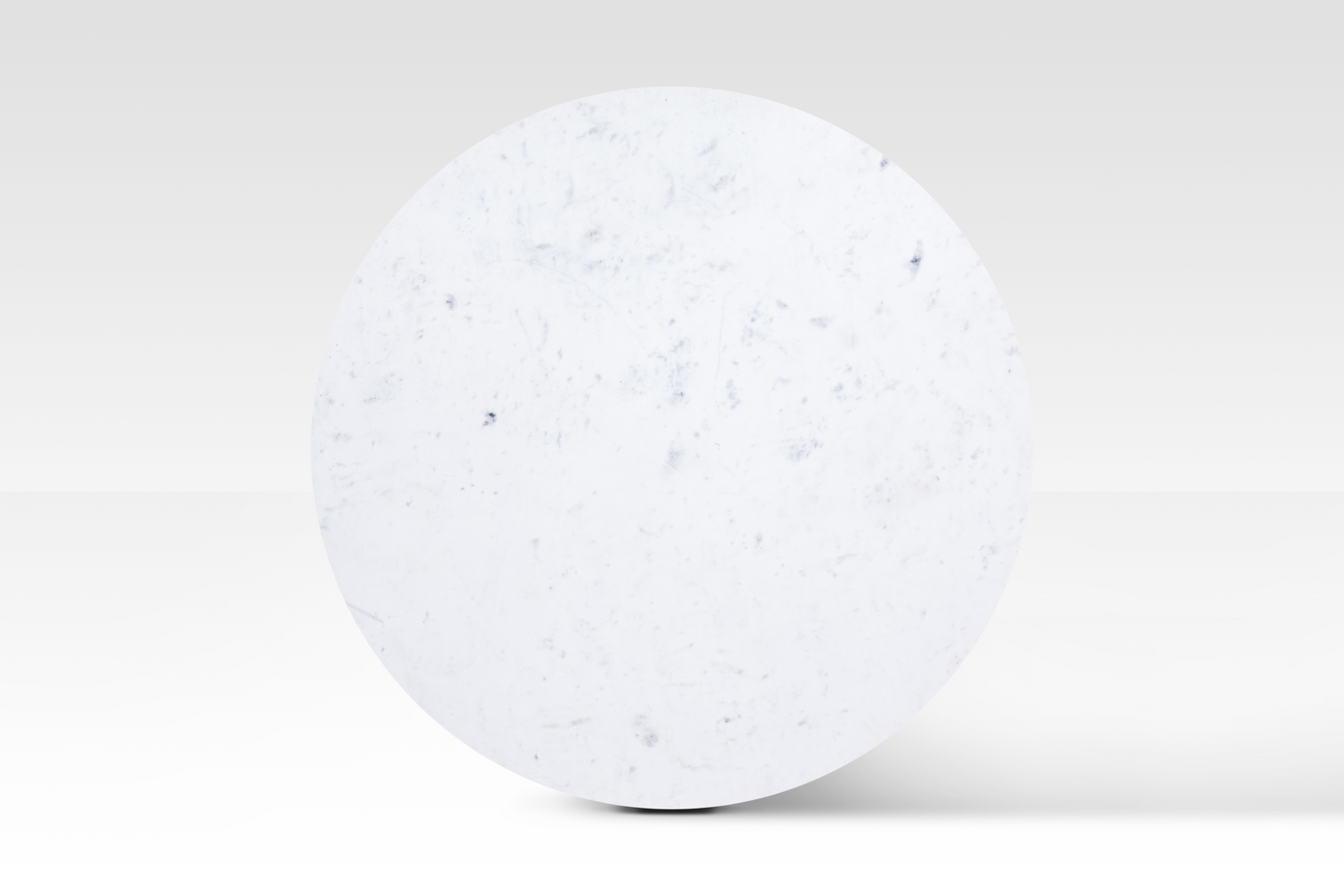Direct overhead view of the Charme Coffee Table emphasizing the smooth circular marble surface and unique natural veining.