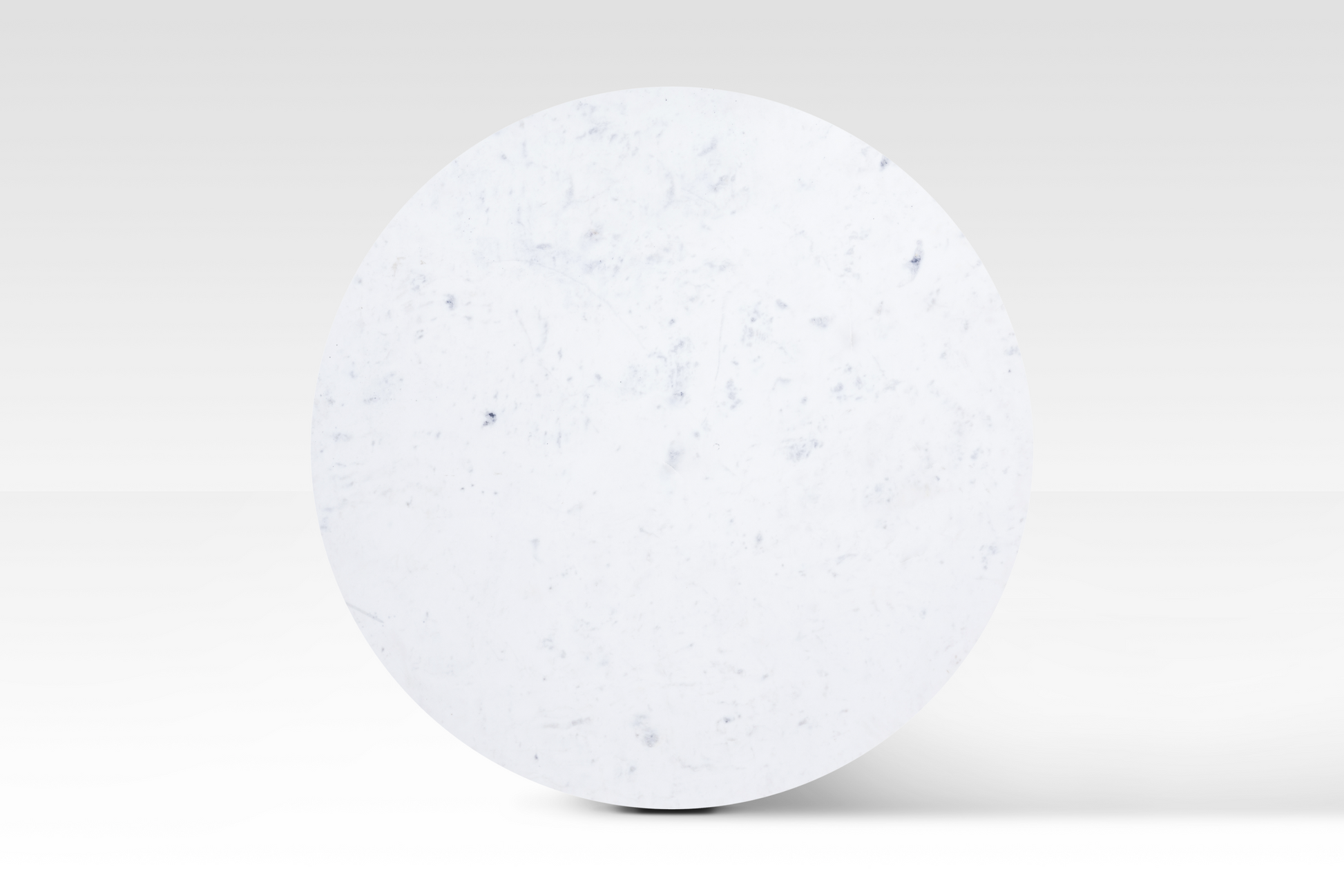Direct overhead view of the Charme Coffee Table emphasizing the smooth circular marble surface and unique natural veining.