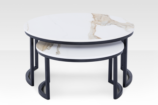 A close-up view of the two Concord nesting tables in black, emphasizing the high-contrast design between the matte metal and solid marble.
