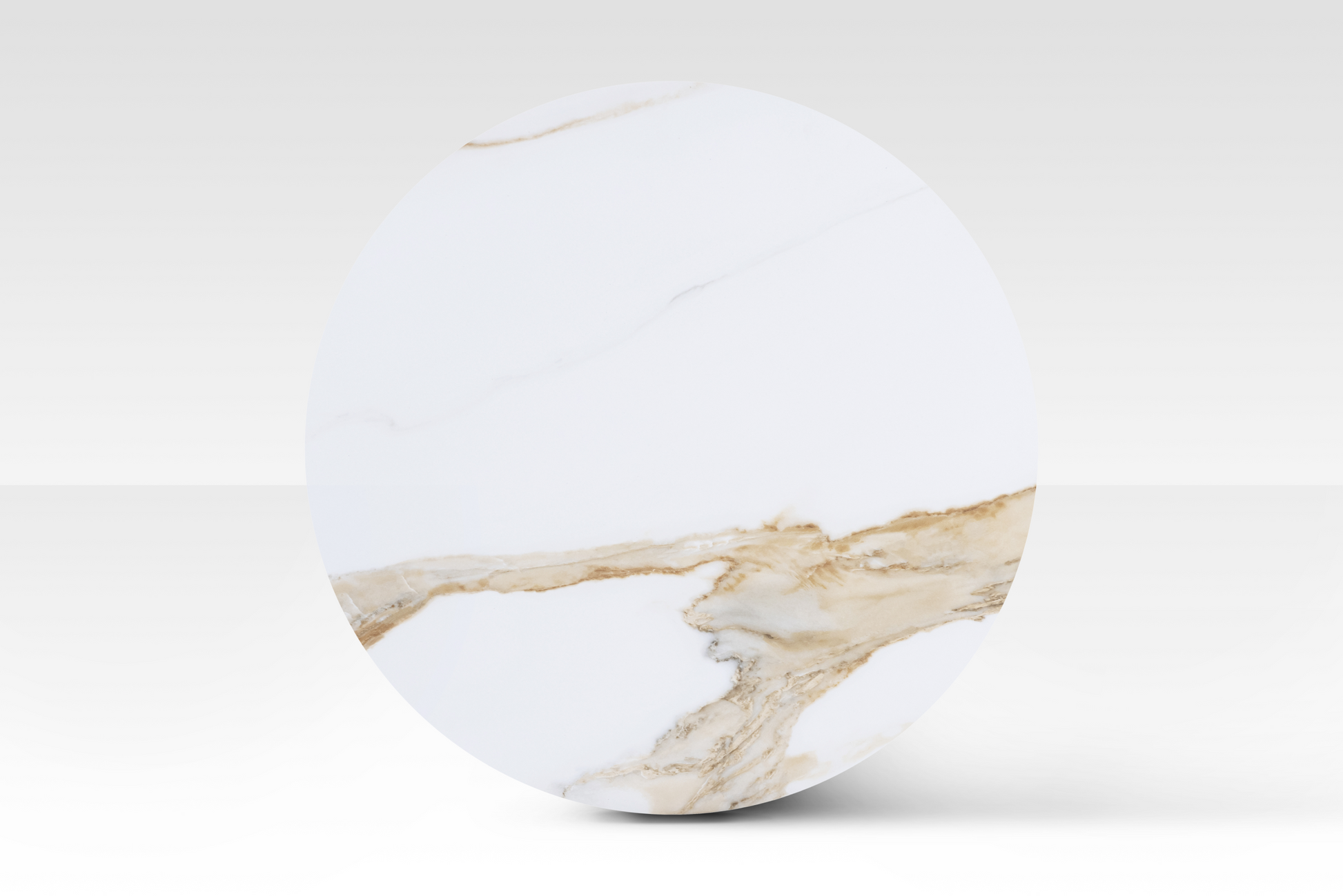 A perfectly circular overhead view of the large Concord nested table, showcasing the unique cloud-shaped solid marble top with authentic organic veining.