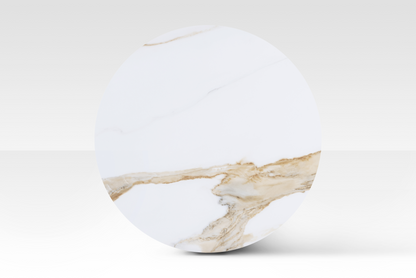 A perfectly circular overhead view of the large Concord nested table, showcasing the unique cloud-shaped solid marble top with authentic organic veining.