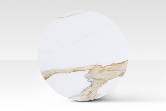 A perfectly circular overhead view of the large Concord nested table, showcasing the unique cloud-shaped solid marble top with authentic organic veining.