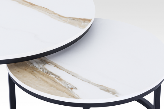 Macro close-up of the black Concord table’s edge, highlighting the durable matte black frame and the unique natural texture of the solid marble veining.