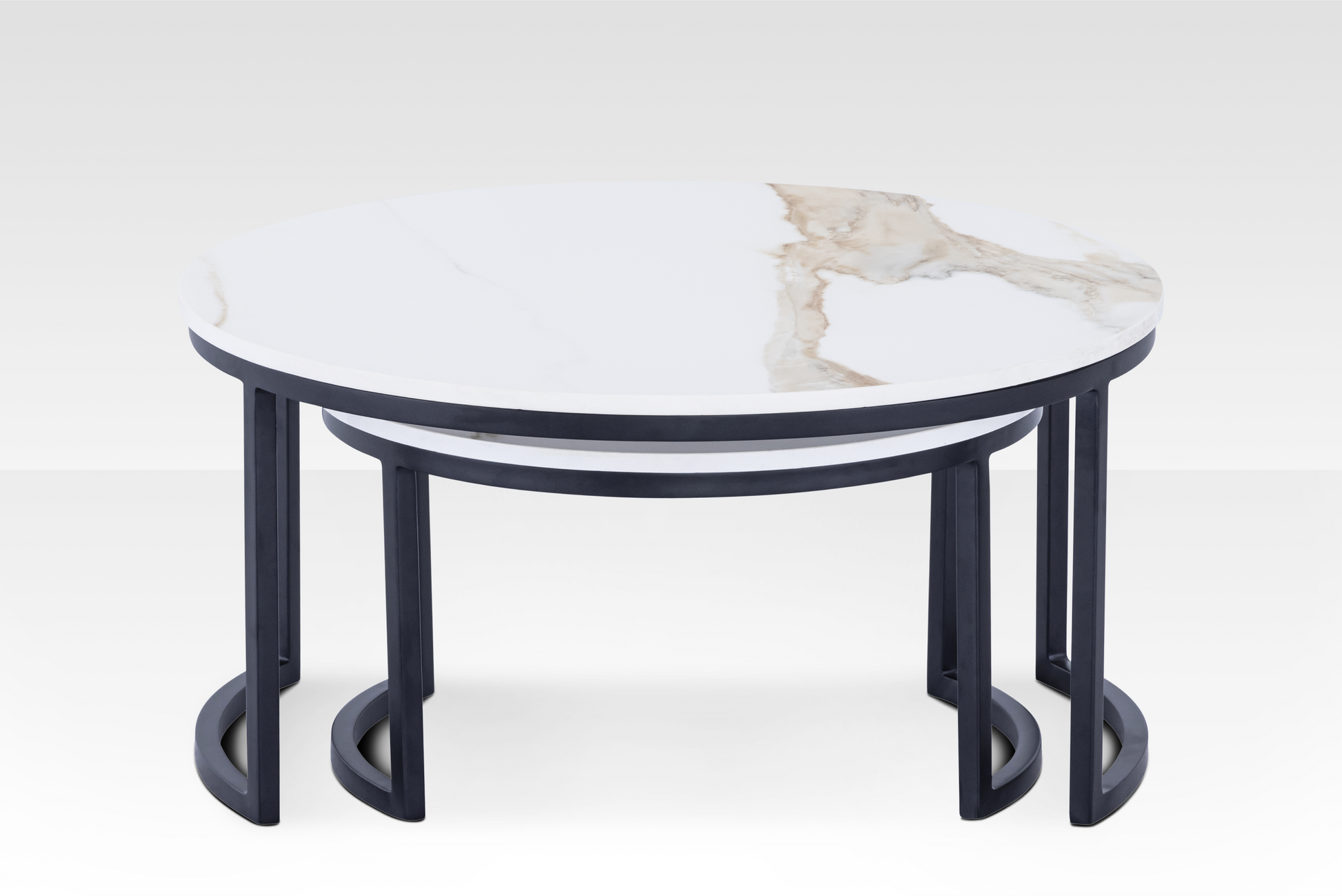 Front view of the black Concord nesting tables layered, showcasing the architectural C-base frame and the space-saving functionality.