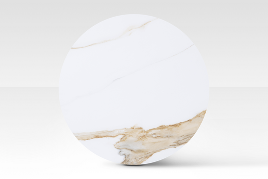 A perfectly circular overhead view of the Concord nestled table, showcasing the authentic organic veining of the solid white marble top.