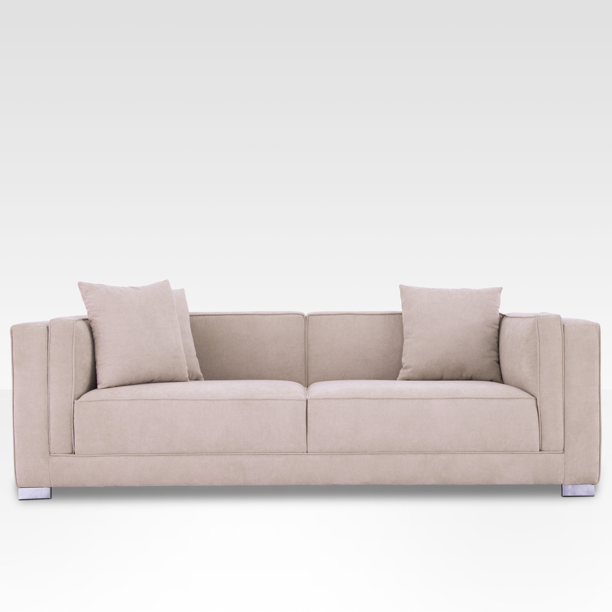Front view of the Elysian sofa in Seaside Sand fabric, showing the symmetrical two-over-two cushion design and chrome legs.