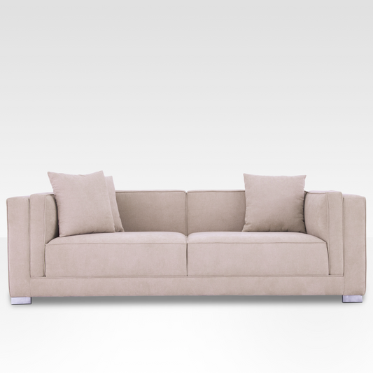 Front view of the Elysian sofa in Seaside Sand fabric, showing the symmetrical two-over-two cushion design and chrome legs.