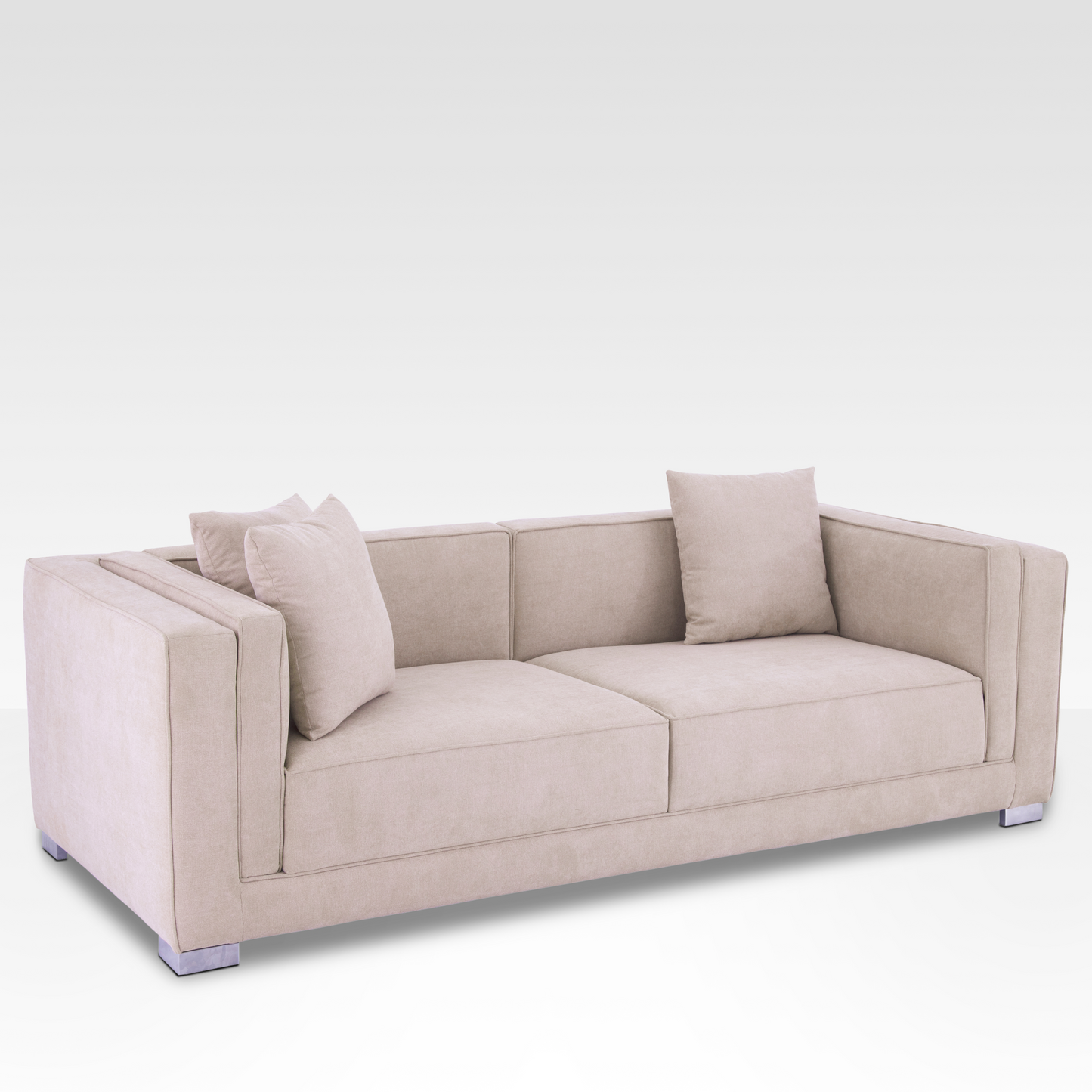 A high-angle view of the Elysian sofa in Seaside Sand, showcasing the proportional two-over-two cushion grid.