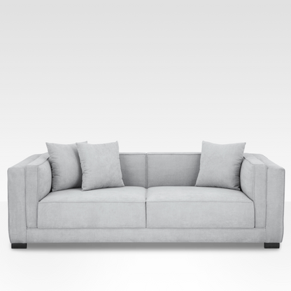 Front view of the Elysian sofa in Steel gray fabric, featuring a symmetrical cushion grid and minimalist dark steel block legs.
