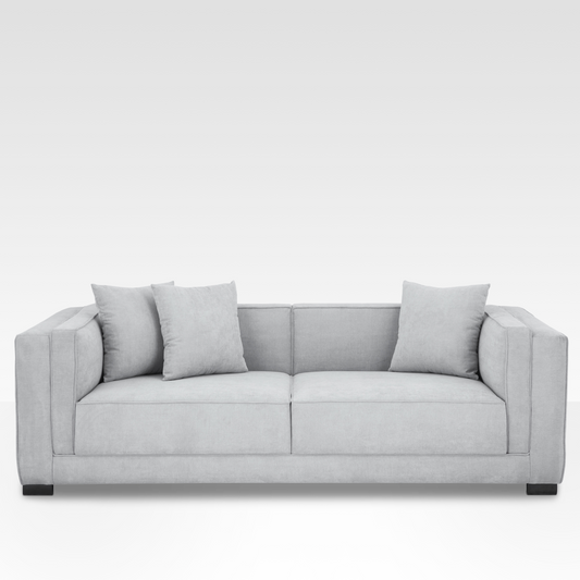 Front view of the Elysian sofa in Steel gray fabric, featuring a symmetrical cushion grid and minimalist dark steel block legs.
