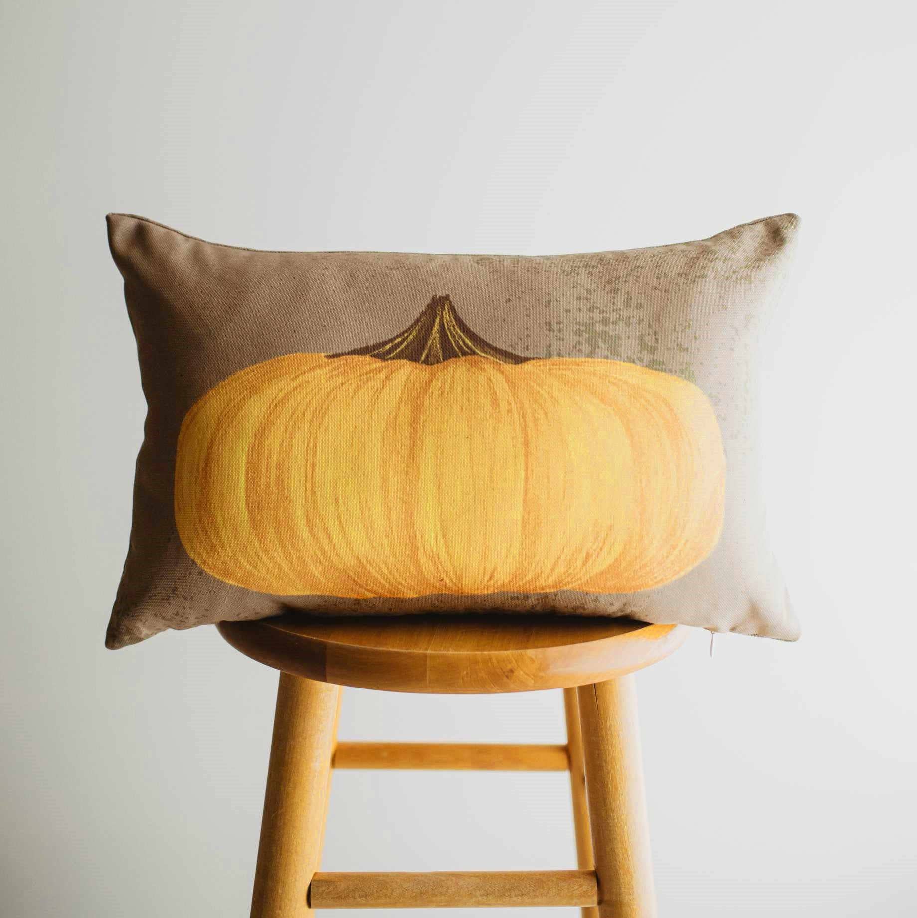 Primitive Flat Fall Pumpkin Lumbar Pillow Cover on a Chair
