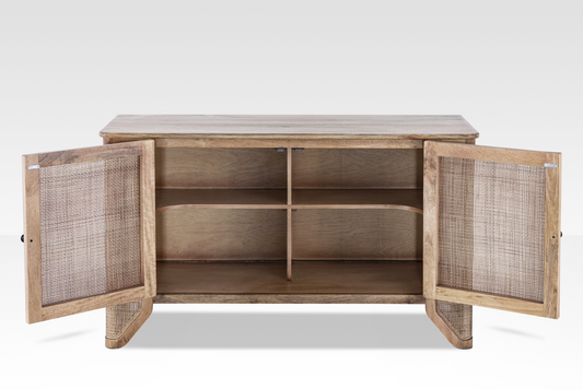 Interior view of the Filigree Sideboard showing the fixed shelving and ventilated natural cane door construction.