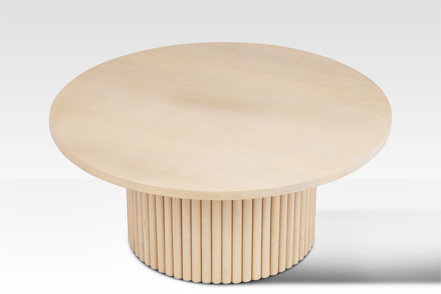 Direct overhead view of the Grove Coffee Table showcasing the smooth circular surface and light natural wood grain.