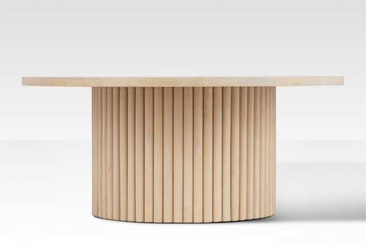 Straight-on profile of the Grove Coffee Table highlighting the rhythmic vertical rods of the fluted pedestal base.
