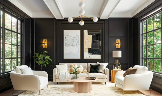 A minimalist Grove Coffee Table anchored in a high-contrast glam living room with black walls, white chairs, and gold accents.