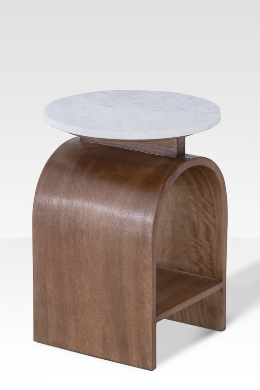 Rear perspective of the Kromme End Table showing the integrated walnut shelf and the substantial architectural support of the curved base.