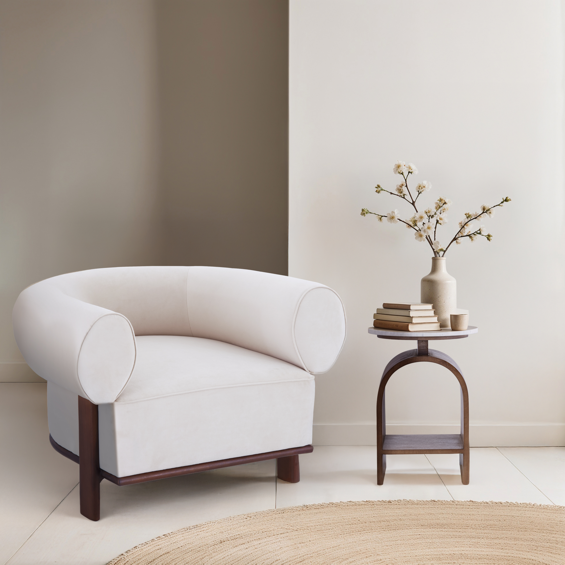 The Kromme End Table paired with the white Gala Accent Chair, featuring a walnut bentwood arch and solid marble top in a minimalist reading nook.
