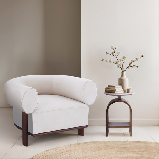 The Kromme End Table paired with the white Gala Accent Chair, featuring a walnut bentwood arch and solid marble top in a minimalist reading nook.