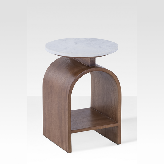An angled view of the Kromme End Table featuring a floating white marble top and a walnut bentwood parabolic arch base with a lower shelf.