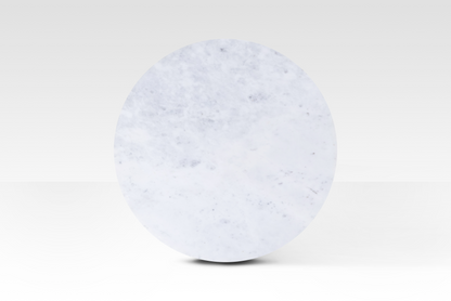 A perfectly circular overhead view of the Kromme End Table, showcasing the natural grey veining and polished surface of the solid white marble top.