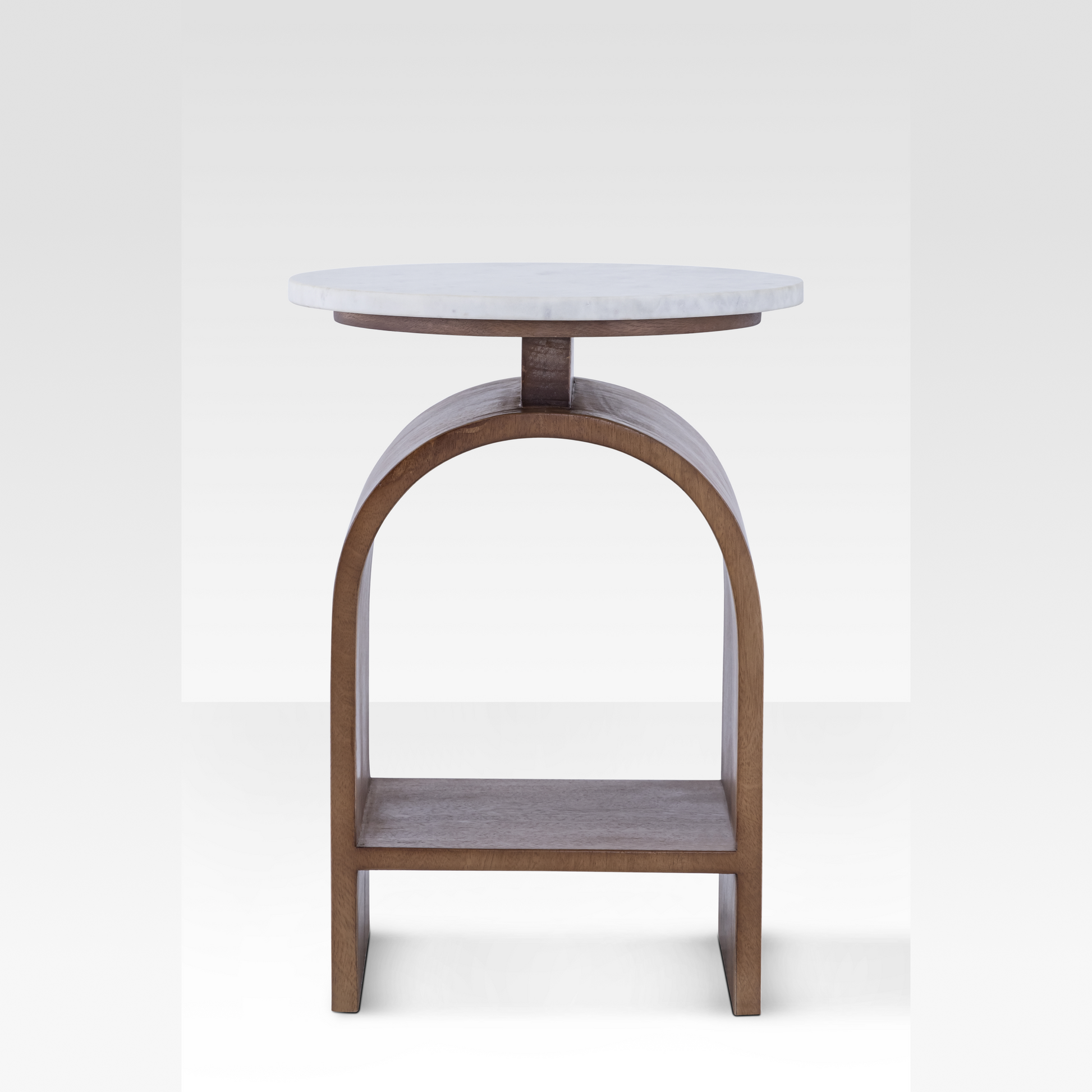 A straight-on profile of the Kromme End Table highlighting the perfect symmetry of its bentwood arch and the thin floating marble surface.