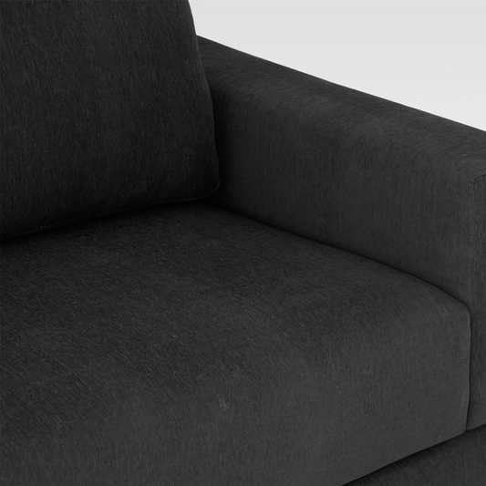 A macro view of the Kyra sofa's Pewter gray fabric, showcasing the durable weave and soft, high-quality texture.