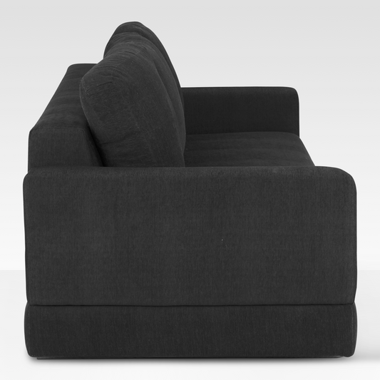 A side profile of the Kyra sofa showing the deep-seated frame and the clean lines of the Pewter gray upholstery.