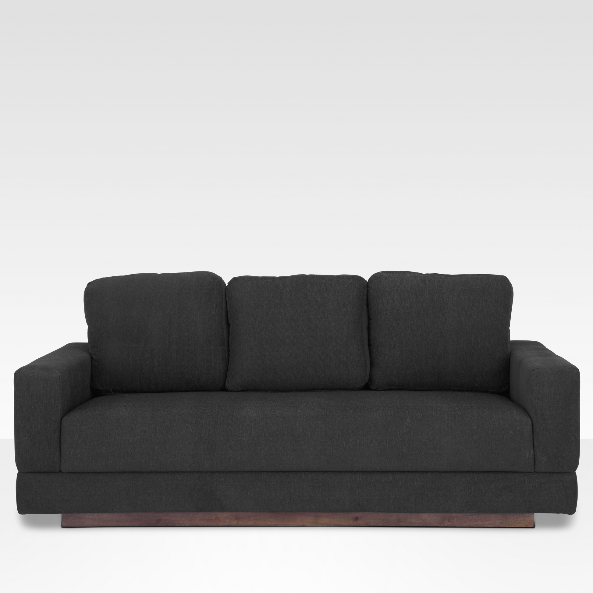 A straight-on view of the Kyra sofa in Pewter gray fabric, featuring a three-over-one cushion design and a solid wood platform base.
