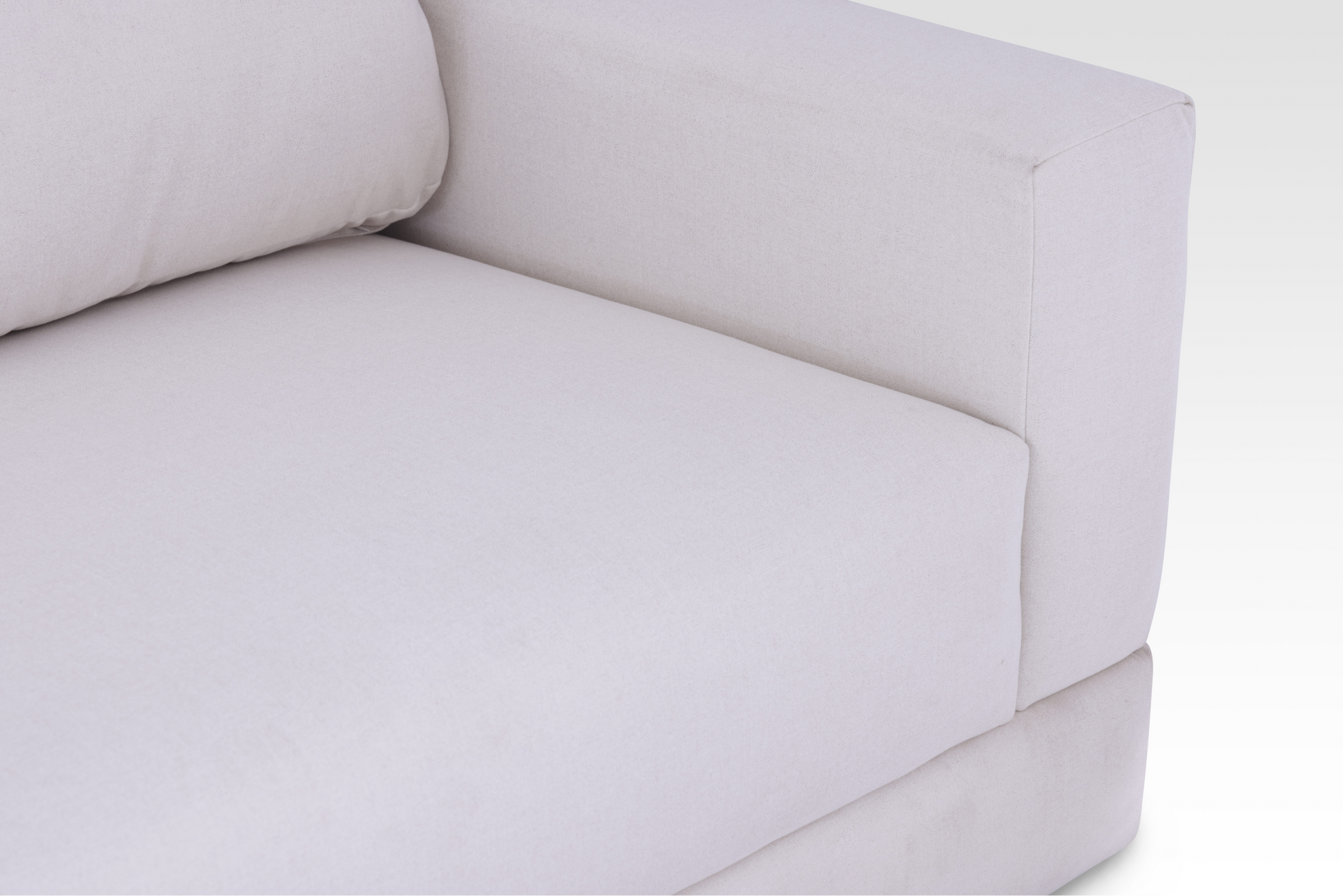 A top-down detail view of the seamless single bench seat block on the Vanilla Cream Kyra sofa.