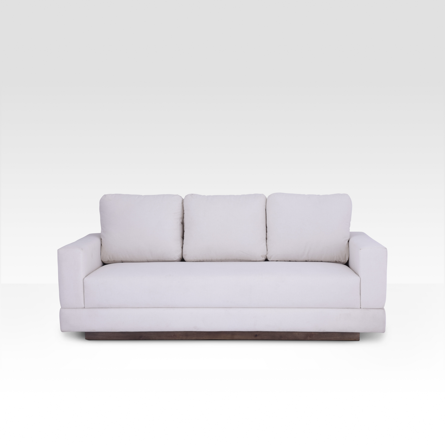 A straight-on view of the Kyra sofa in Vanilla Cream, showcasing the seamless bench seat and three plush back cushions.