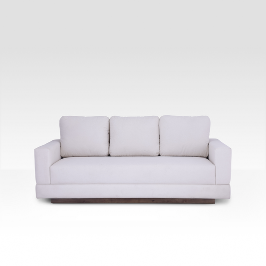 A straight-on view of the Kyra sofa in Vanilla Cream, showcasing the seamless bench seat and three plush back cushions.