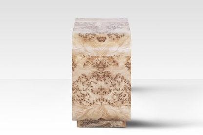 A side perspective of the Luca End Table showcasing the intricate swirling grain and natural 'eyes' of the rare Mappa Burl veneer.
