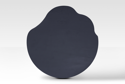 Overhead view of the smaller Nook Nestled Coffee Table in matte black, showcasing its biomorphic silhouette and smooth, sophisticated finish.