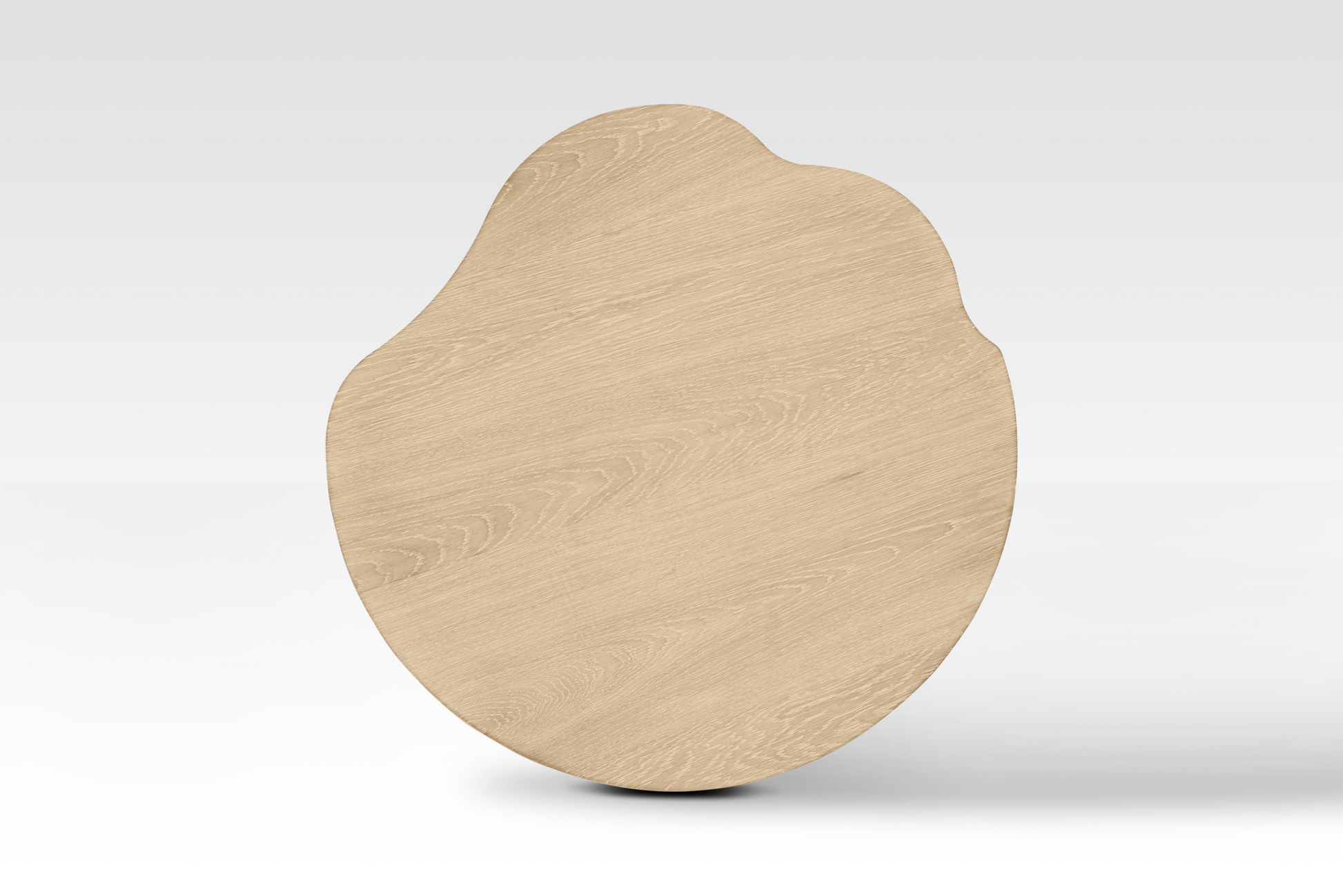 Top-down view of the large Nook Nestled Coffee Table in natural oak, highlighting the organic cloud-shaped wavy edges and premium wood grain.