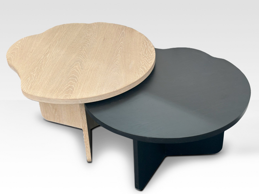 Overhead view of the oak and black nesting coffee tables highlighting the irregular wavy edges and organic design