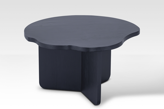 The individual Nook nestled table in matte black, showcasing the architectural tri-vane pedestal support and smooth finish.